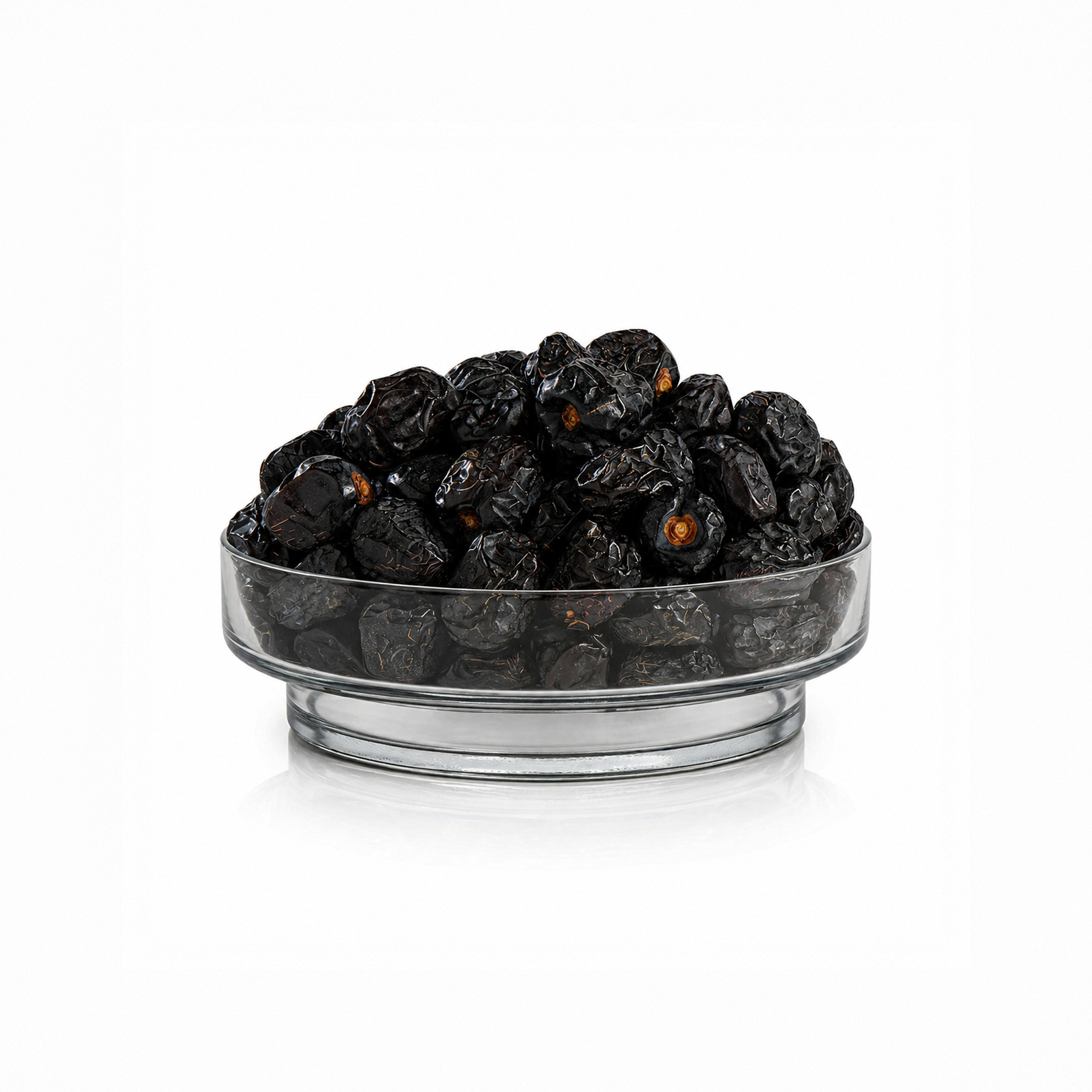 Premium Ajwa Dates in a glass bowl on a white background, original Ajwa Khajoor from Madinah Saudi Arabia